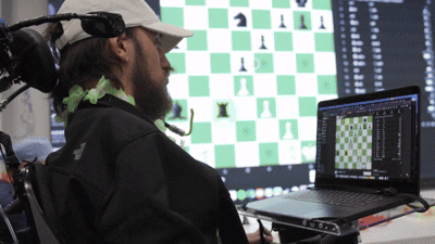 CuriousTitans-Language to AI: The Story of Information Revolutions Neuralink Person Playing Chess